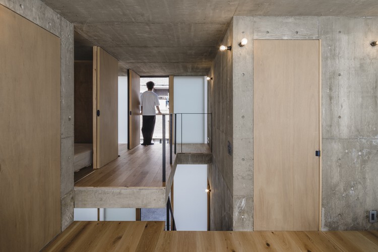 Дом с узором в клетку / IGArchitects - Фотография интерьера