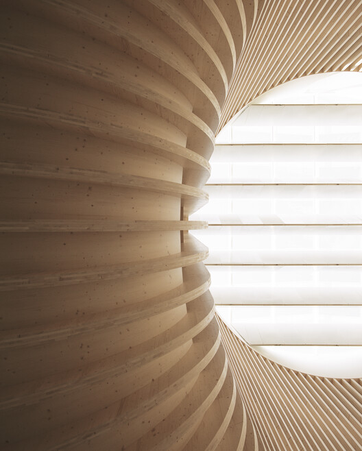 Katajanokan Laituri Wood Office and Hotel Building / Anttinen oiva Architects - Интерьерная фотография, лестница, дерево